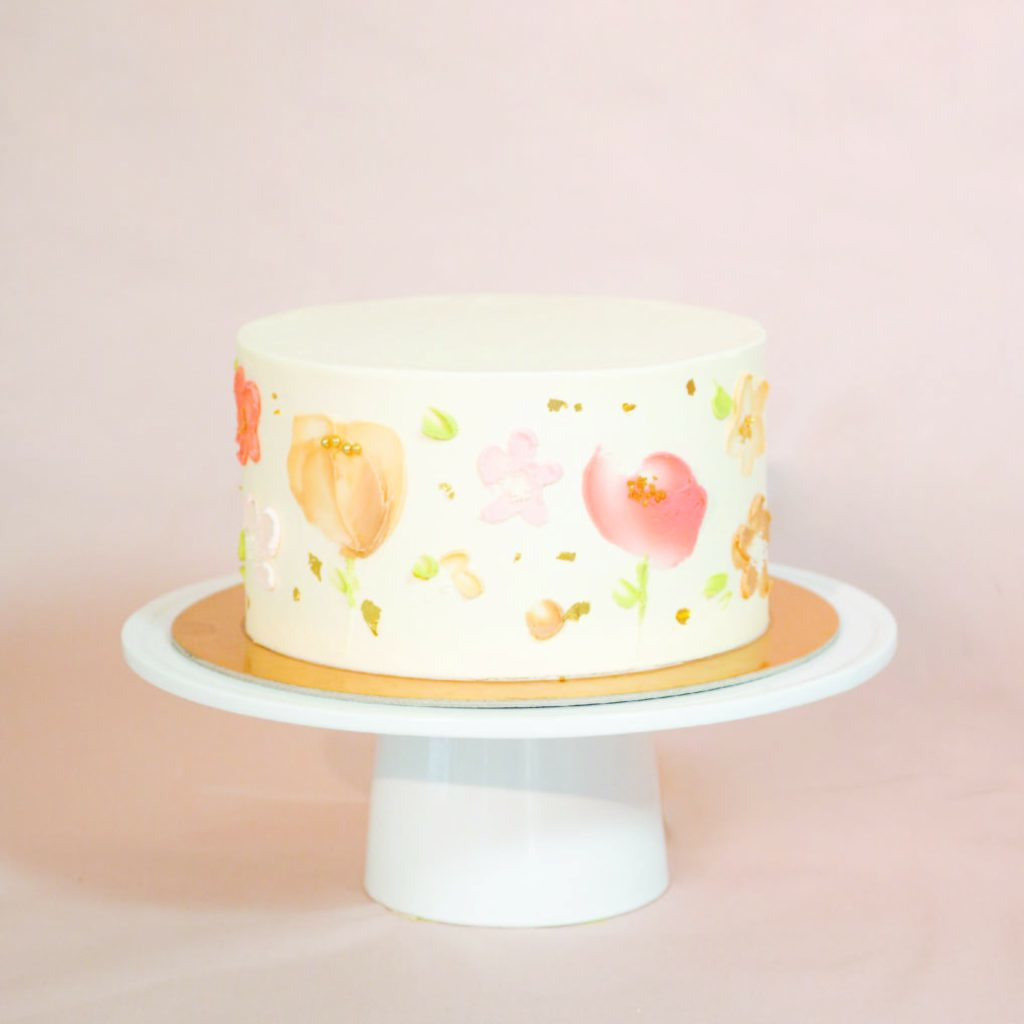 43 Cute Buttercream Flower Cake Ideas : Colourful Flower on Pale Green Cake